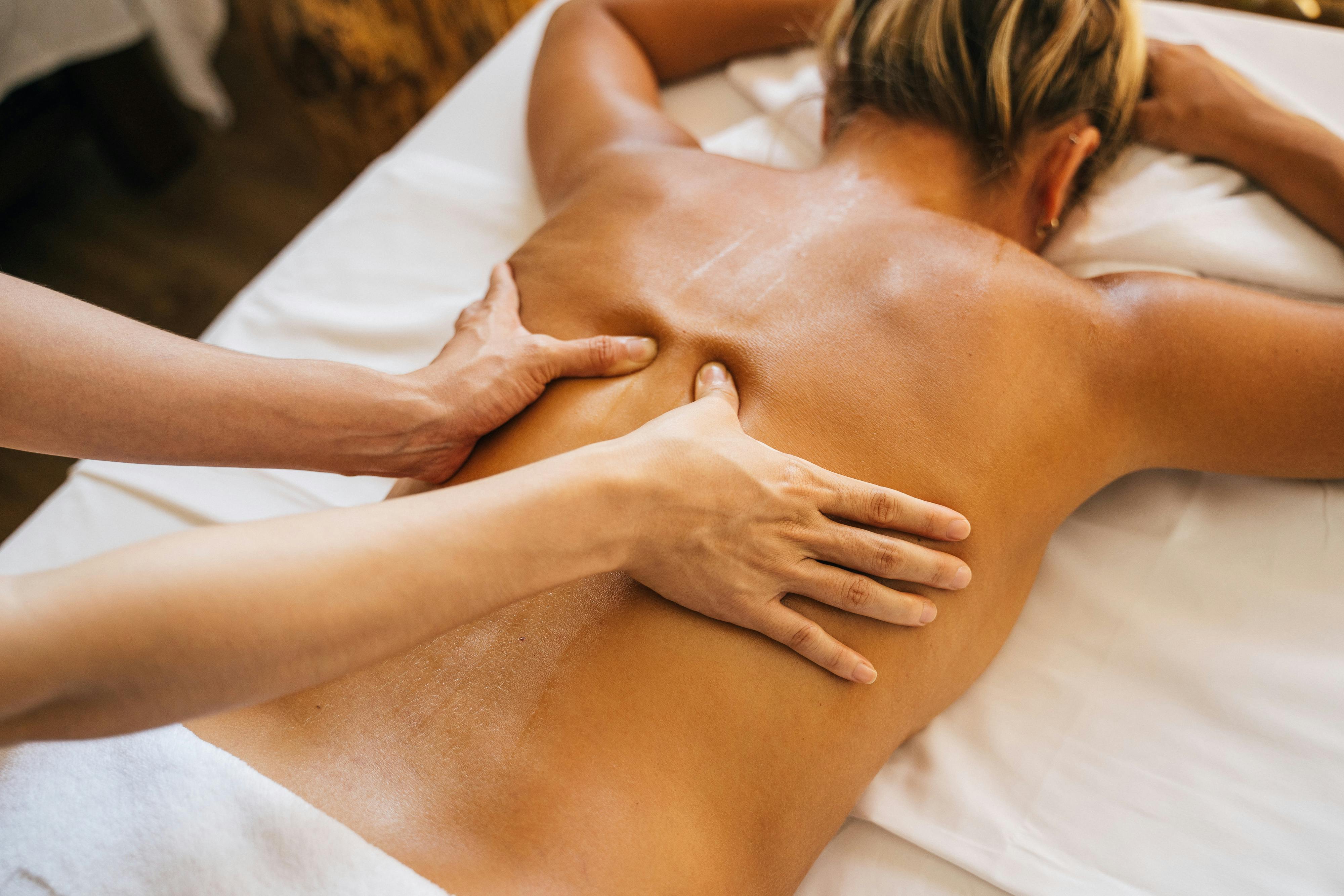 Therapist performing a full body back massage at Gangnam Korean Massage Therapy in St Joseph, Missouri