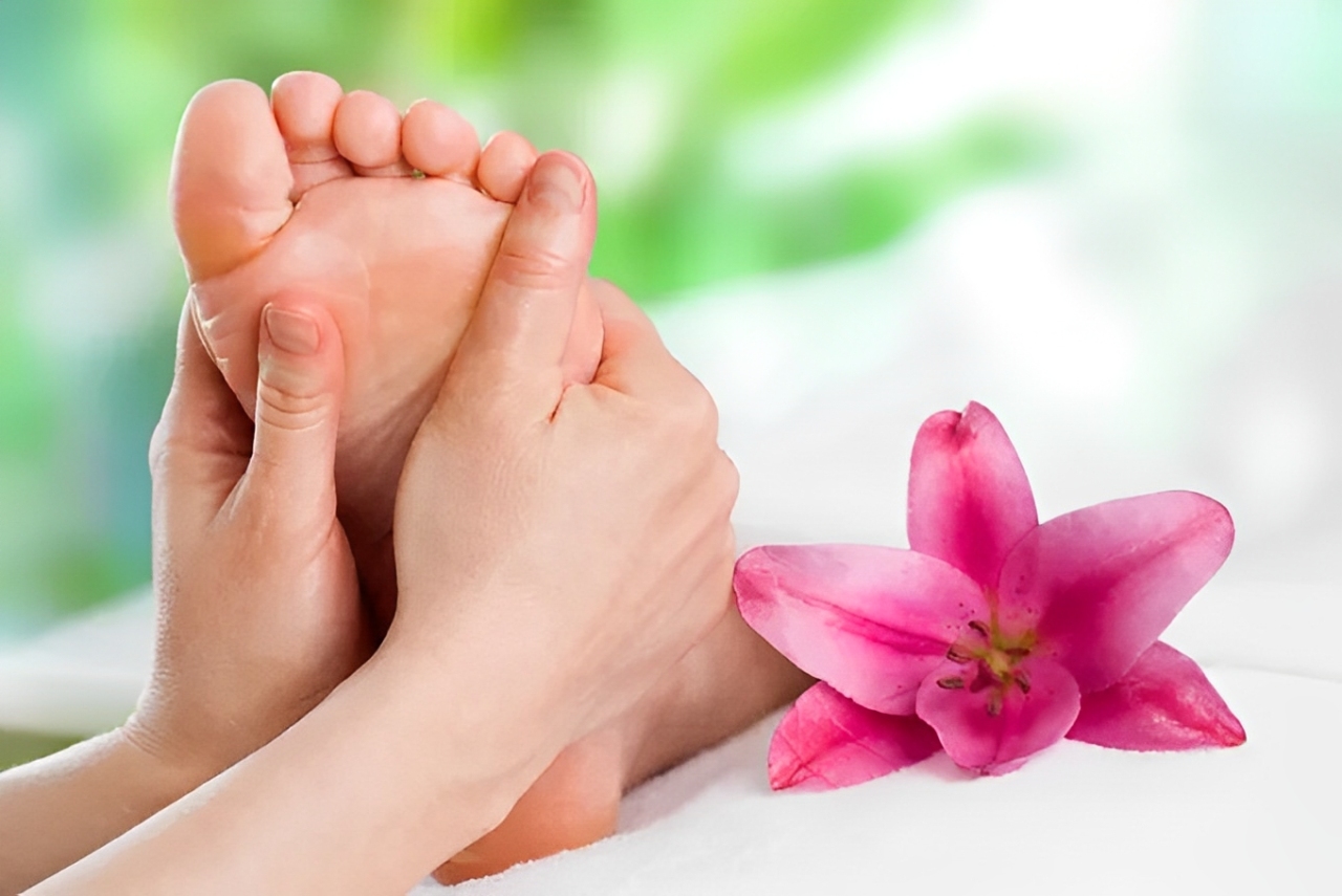 Therapist massaging a client’s foot sole area at Malaysian Health Massage Omaha