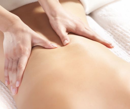 Therapist performing stress relief upper back massage at Four Seasons Asian Massage St Joseph – focused on easing shoulder and neck tension.