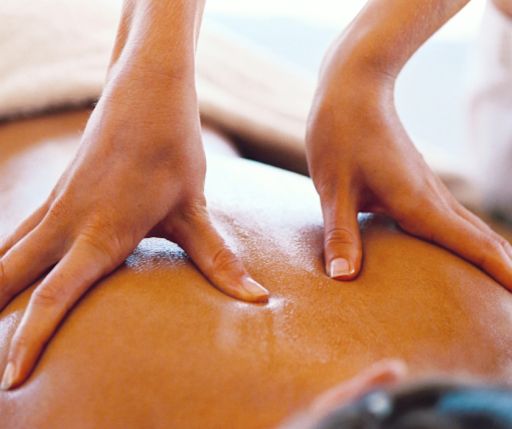 Therapist performing stress relief upper back massage at Green World Massage Omaha – focused on reducing shoulder and neck tension.